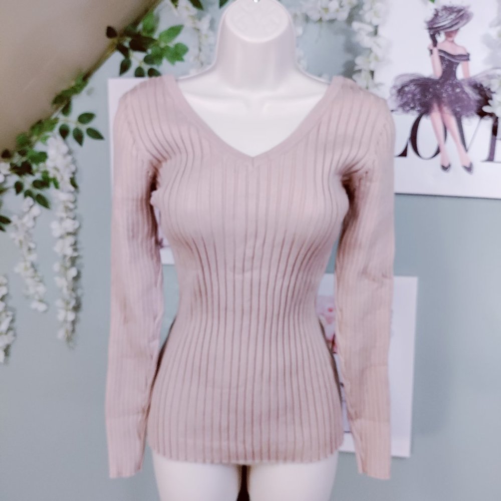 Texture sweater with classic ribbing along with a v-neck in the front and back